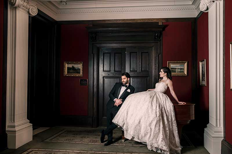 Wedding couple near the grand piano in the Galleria (photo by Luxe Images by Jill).